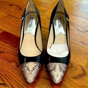 Brand new Michael Kors black leather pumps with snakeskin trim.
